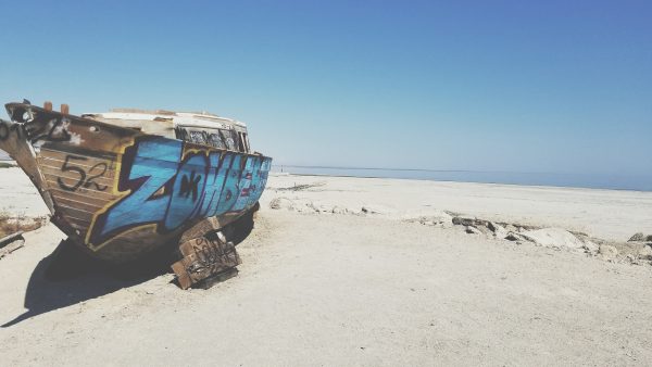 abandoned boat on the sand in saltonsea