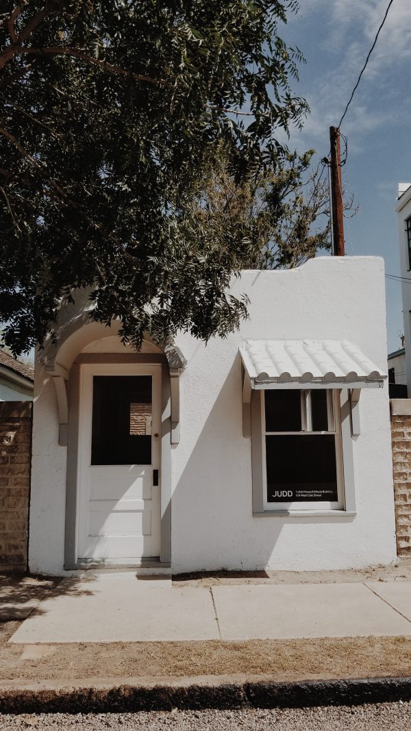 white adobe building in marfa, texas