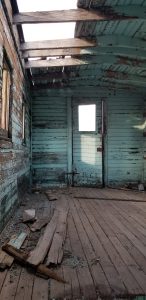 blue abandoned broken down building in beatty, nevada