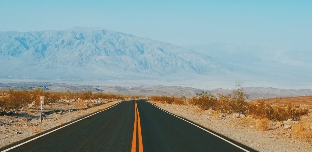 view from the highway of mountains under blue haze