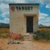 tiny target building in west texas with red cart in front