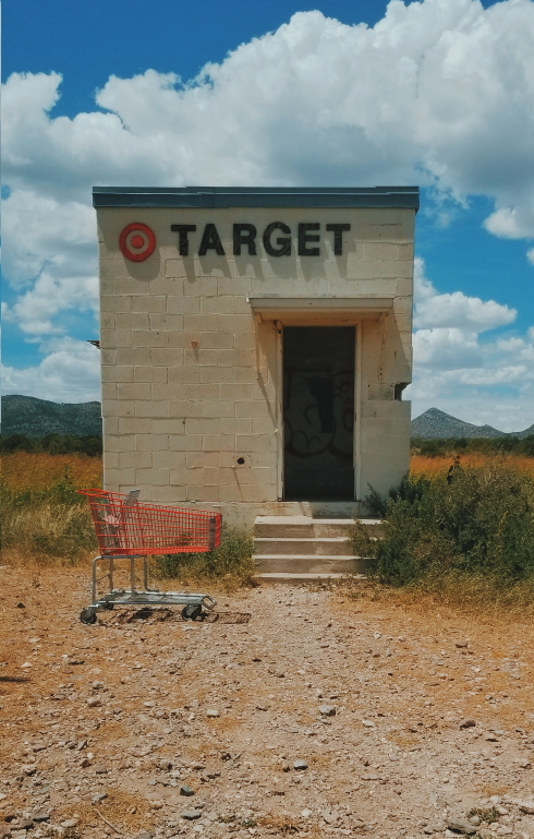 tiny target building in west texas with red cart in front