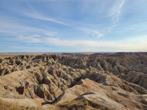 photo of mountains under blue sky