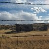 photo of abandoned building between barbwire fence