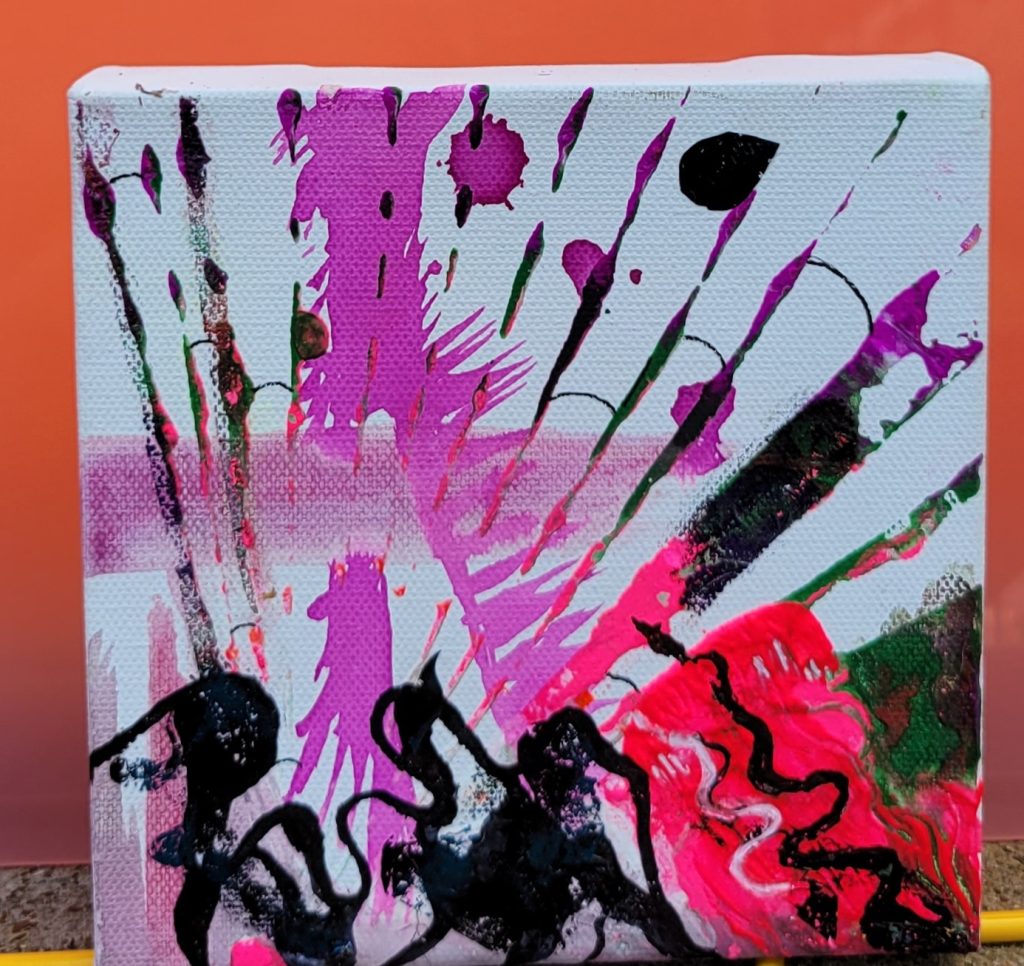 acrylic art on white canvas of a starburst of pink lines with black shapes below