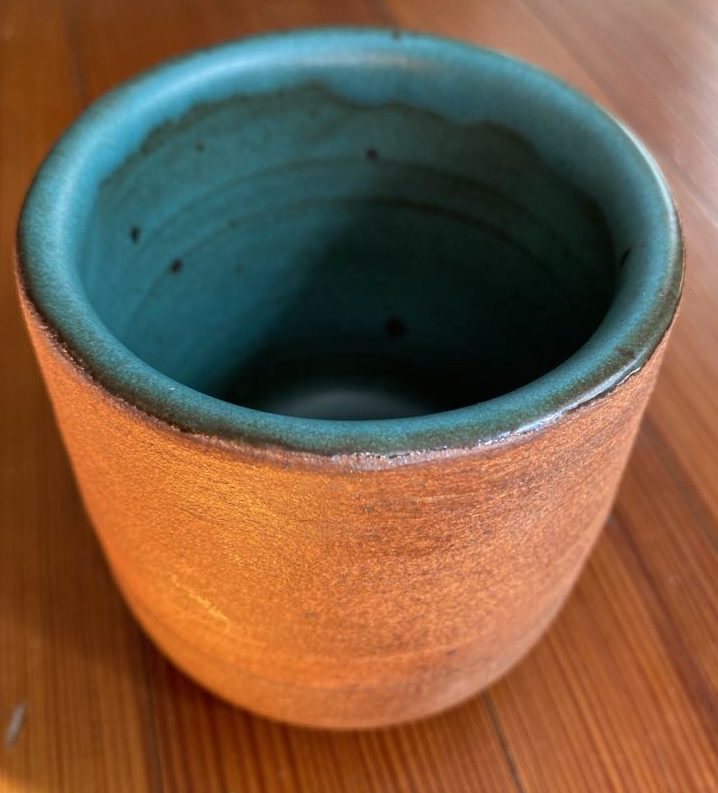 blue and brown ceramic cup