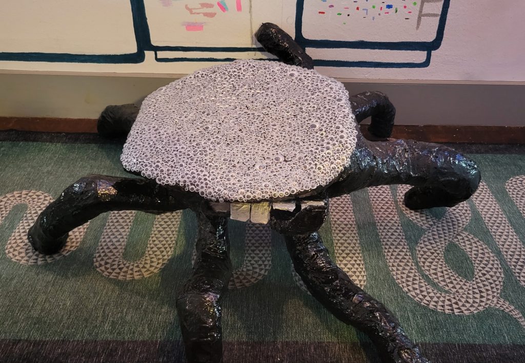 paper mache spider table with googly eyes